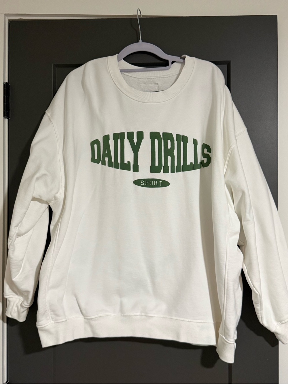 Daily Drills Women's Crewneck Sweatshirt in White with Green Logo